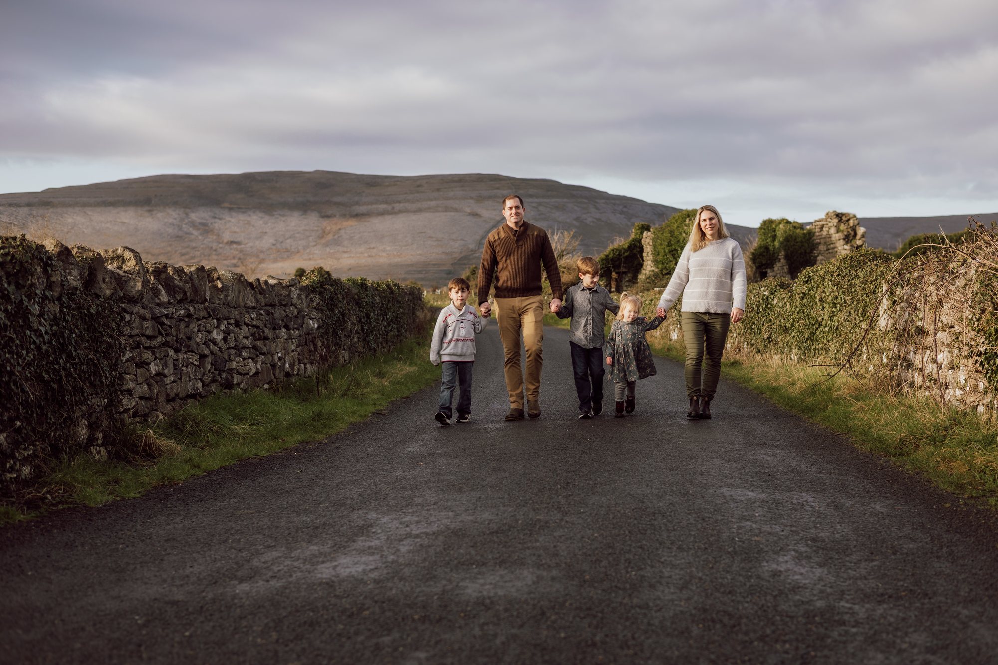 Family walking together through the Burren landscape