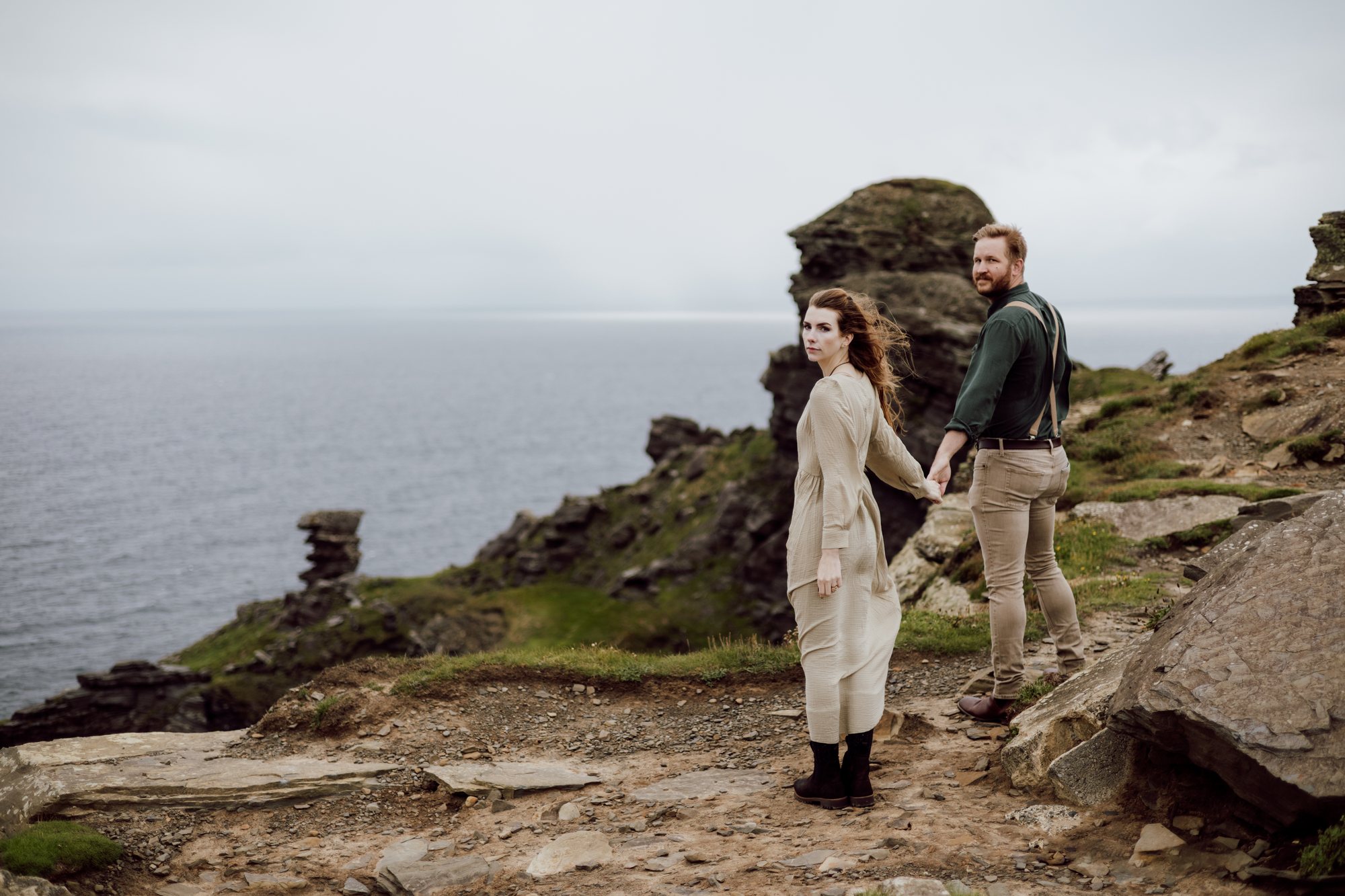 Couple walking together along the Irish coast