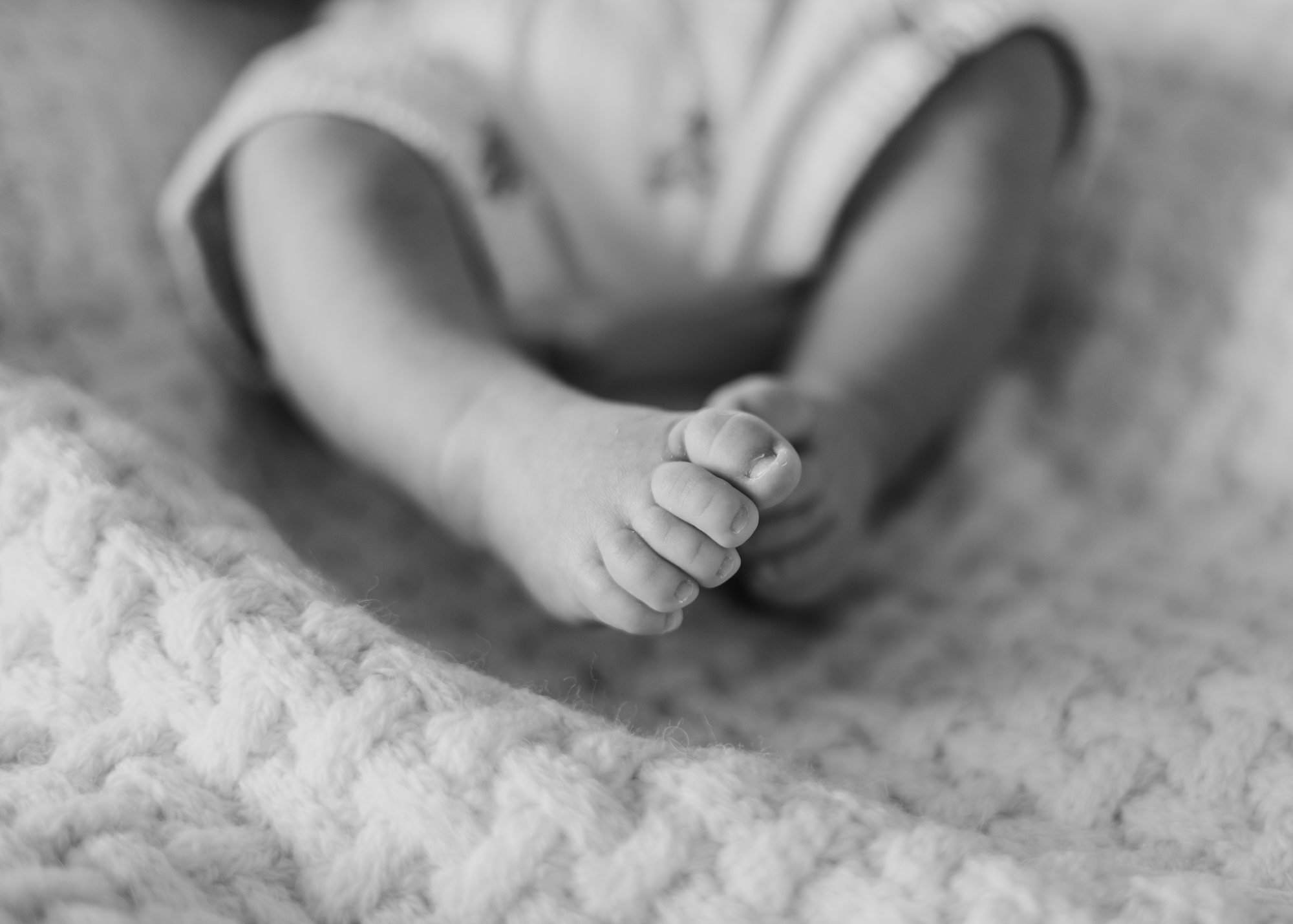 Close detail of a newborn’s tiny feet